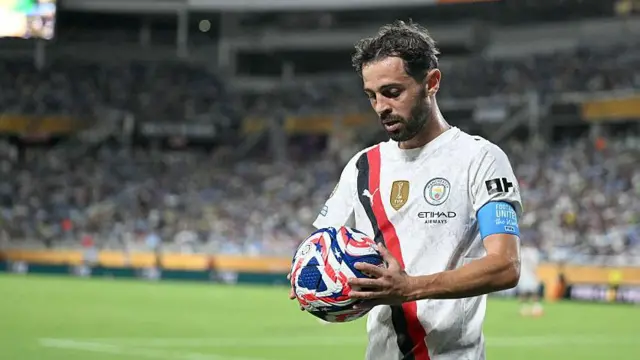 Bernardo Silva holding a football during Manchester City's defeat by Al-Hilal at the Club World Cup