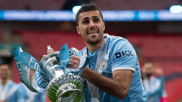 Rodri lifts the FA Cup trophy