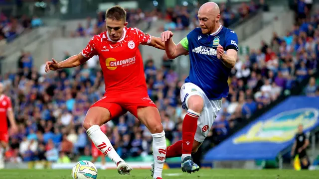 Chris Shields challenges for the ball