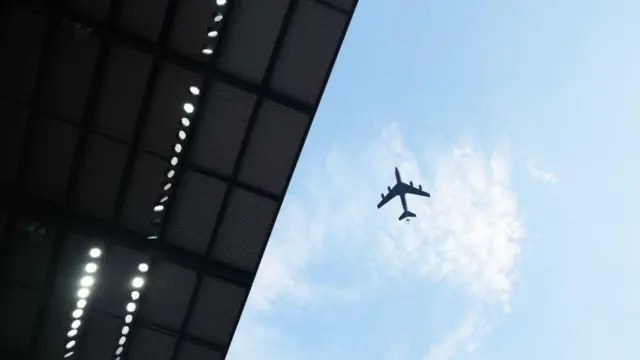 Plane flies over stadium