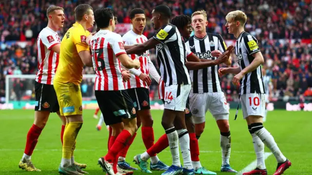 Newcastle and Sunderland players in action
