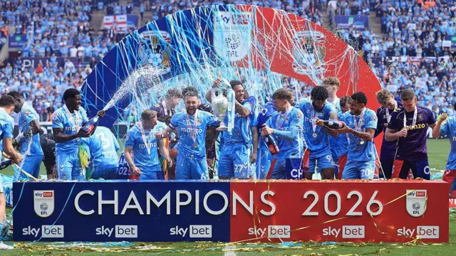 Coventry City celebrate after winning the Championship