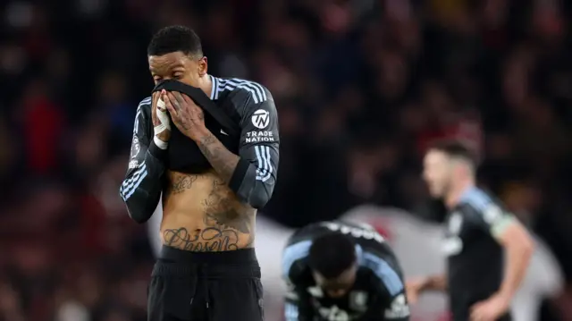 Ezri Konsa and Aston Villa players look dejected after Arsenal defeat