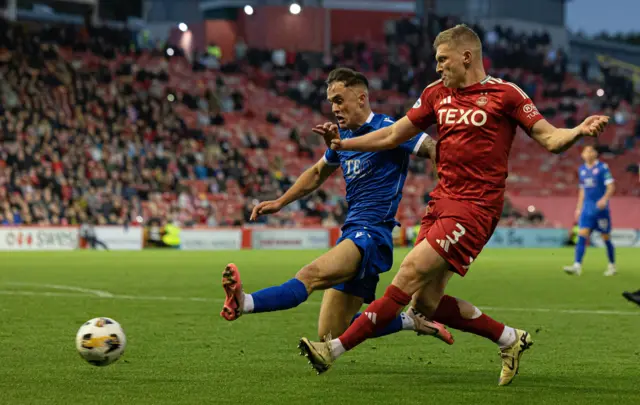 Spartans' Mark Stowe (L) and Aberdeen's Jack MacKenzie in action during a Premier Sports Cup quarter-final match between Aberdeen and The Spartans at Pittodrie