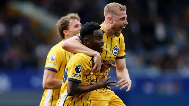 Brighton players celebrate a goal