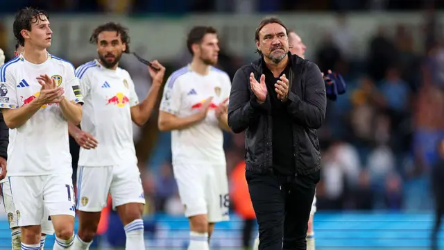 Daniel Farke and Leeds players applaud supporters at Elland Road