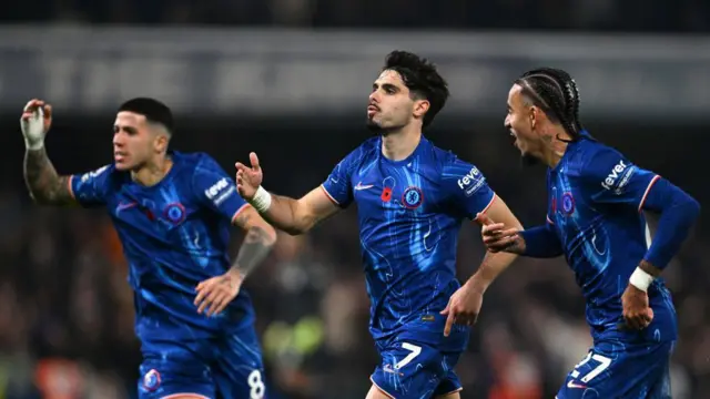 Enzo Fernandez, Pedro Neto and Malo Gusto celebrate a goal for Chelsea