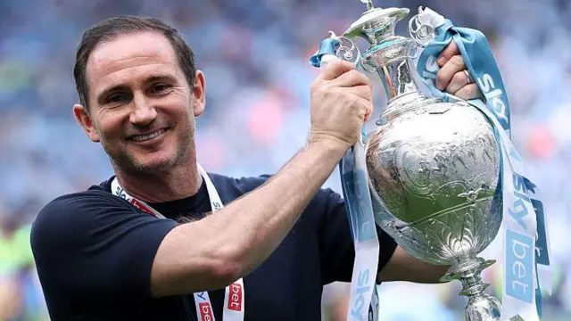 Frank Lampard holds the Championship trophy