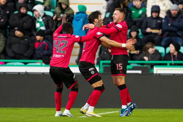 St Mirren's Caolan Boyd-Munce (R) and Hyeokkyu Kwon celebrate after Alex Gogic (not in frame) scores to make it 1-0 during a cinch Premiership match between Hibernian and St Mirren at Easter Road Stadium, on February 03, 2024, in Edinburgh, Scotland. 