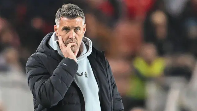 Rob Edwards looks on thoughtfully during match