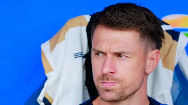 A close-up of Aaron Ramsey in August 2025 in front of a blue background