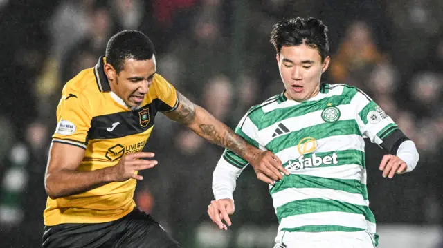 Livingston's Cristian Montano and Celtic's Hyunjun Yang