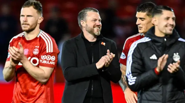 Jimmy Thelin celebrates with Aberdeen players