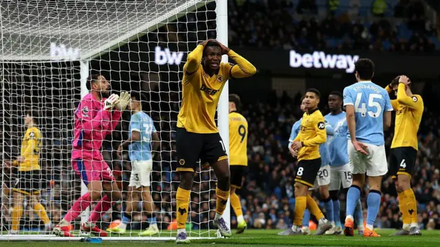 Yerson Mosquera reacts after hitting the crossbar with a header
