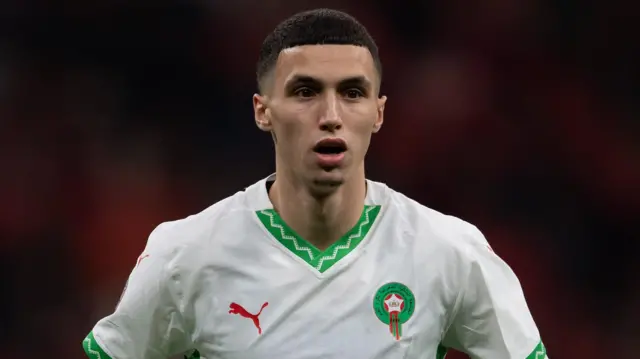 Bilal El Khannous wearing Morocco's white shirt with green trim and a red Puma logo during the Africa Cup of Nations quarter-final match with Cameroon at Prince Moulay Abdellah Stadium on 9 January 2025