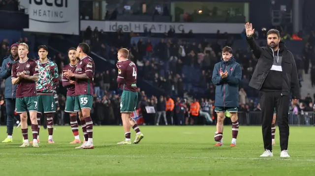 Vitor Matos and Swansea players acknowledge their fans after defeat at West Brom