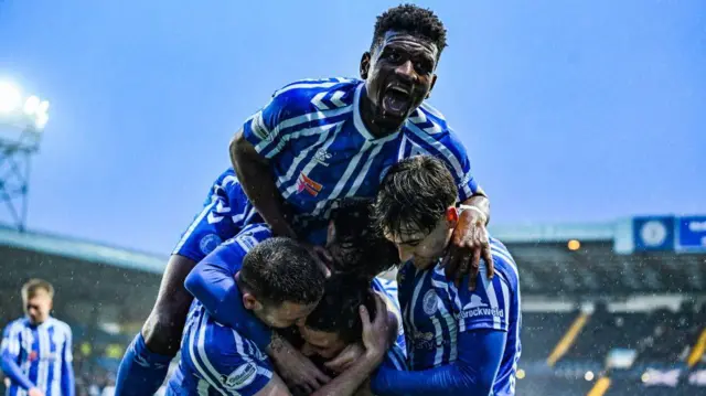 Kilmarnock's Tom Lowery (C) celebrates with Aaron Tshibola after scoring to make it 1-0 during a William Hill Premiership match between Kilmarnock and Dundee at the BBSP Stadium Rugby Park