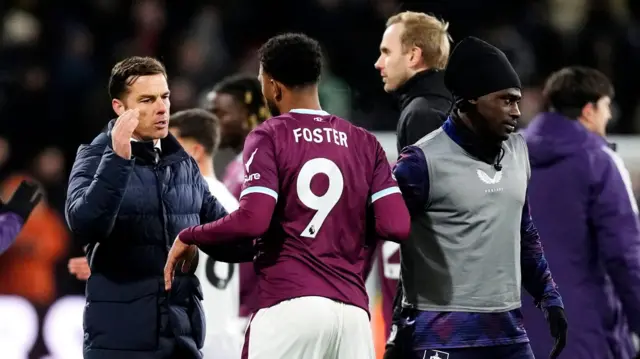 Scott Parker greets striker Lyle Foster after the game
