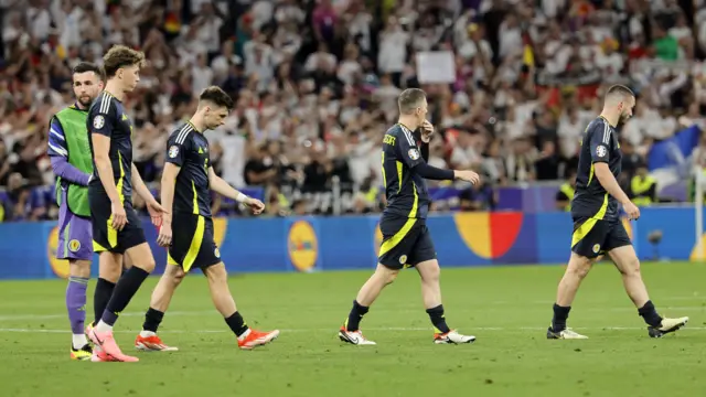 Players of Scotland look disappointed as they leave the pitch after losing the UEFA EURO 2024 group A match between Germany and Scotland in Munich, Germany