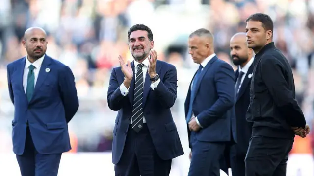 Newcastle United co-owner Mehrdad Ghodoussi applauds the fans