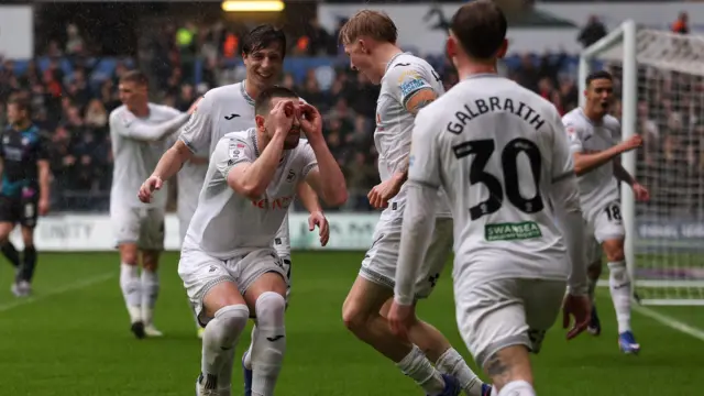 Zan Vipotnik celebrates with team-mates 
