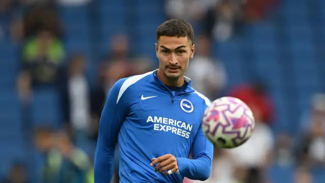 Diego Coppola in action during warm-up for Brighton