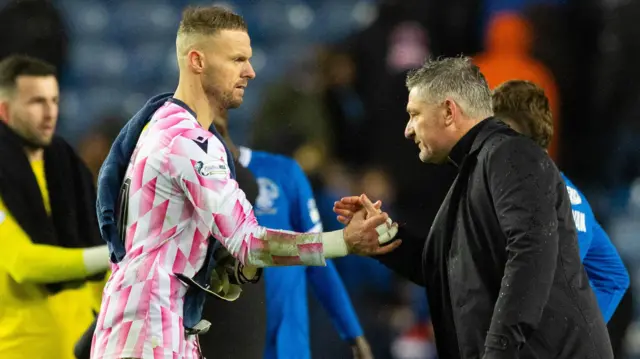 Dundee Manager Tony Docherty and Trevor Carson (L) at full time during a William Hill Premiership match between Rangers and Dundee at Ibrox Stadium