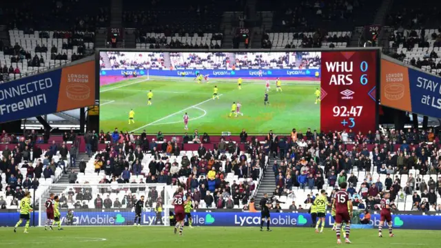 The LED board shows the 0-6 scoreline during the Premier League match between West Ham United and Arsenal FC 