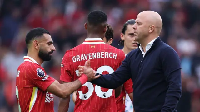 Mohamed Salah of Liverpool and Arne Slot, Manager of Liverpool, shale hands after the Premier League match between Liverpool FC and AFC Bournemouth at Anfield