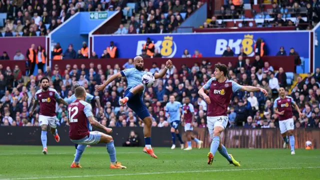 Bryan Mbeumo of Brentford scores his team's second goal during the Premier League match between Aston Villa and Brentford FC at Villa Park