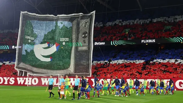 Crystal Palace fans tifo display with a map with London to Leipzig and the words "we are the boys who will win your little game" during the UEFA Conference League 