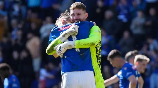 Andy Fisher celebrates St Johnstone's win with Daniels Balodis