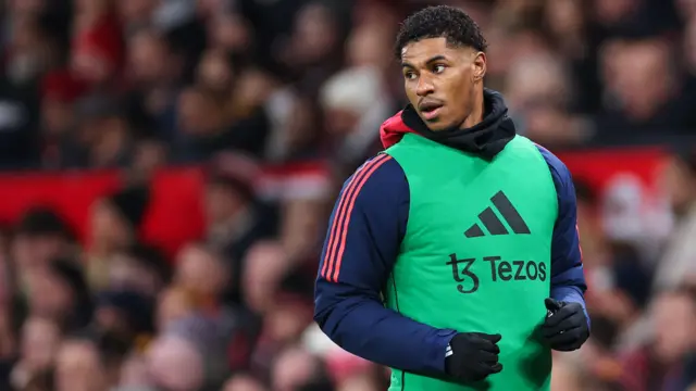 Marcus Rashford warms up for Manchester United