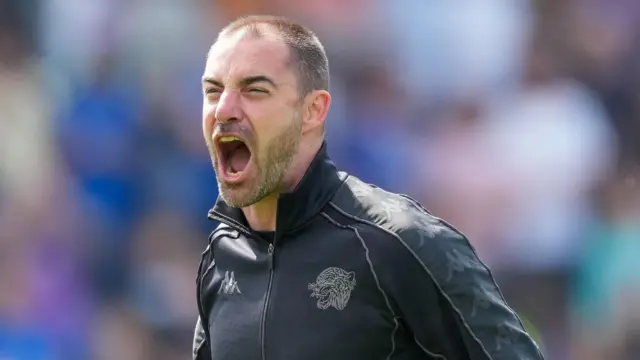 Ruben Selles roaring in celebration