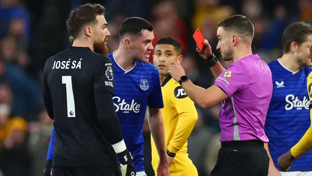 Michael Keane of Everton is shown the red card by referee Thomas Kirk