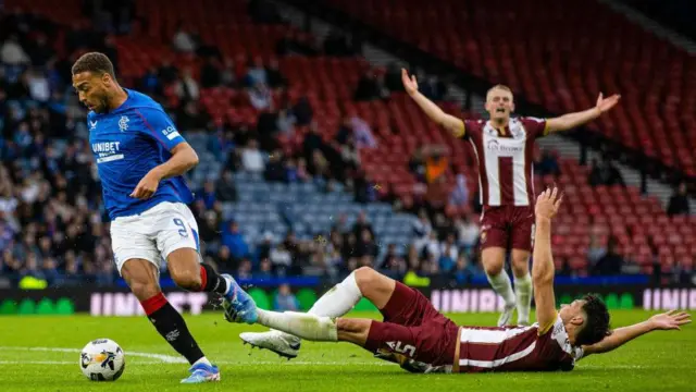 Cyriel Dessers emerged from a challenge with Saints defender Jack Sanders to score