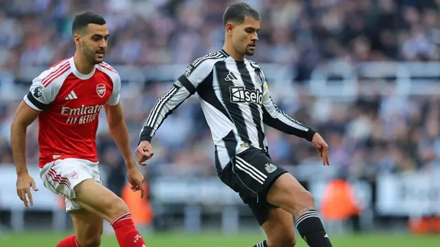Bruno Guimaraes and Mikel Merino compete