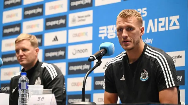 Eddie Howe and Dan Burn speaking in a pre-match press conference
