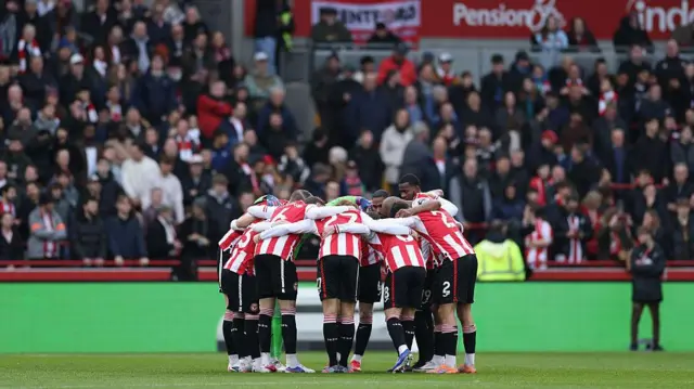 Brentford players in a huddle
