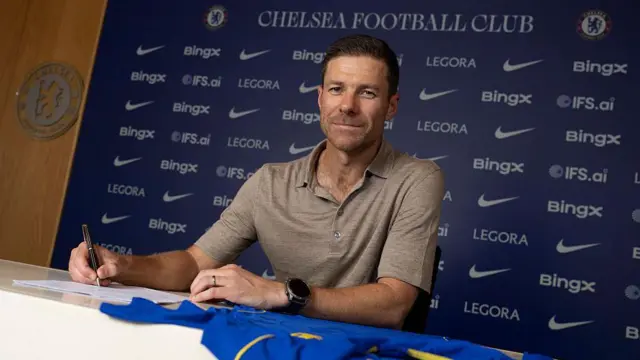 Xabi Alonso at signs his contract at Chelsea's Training Ground