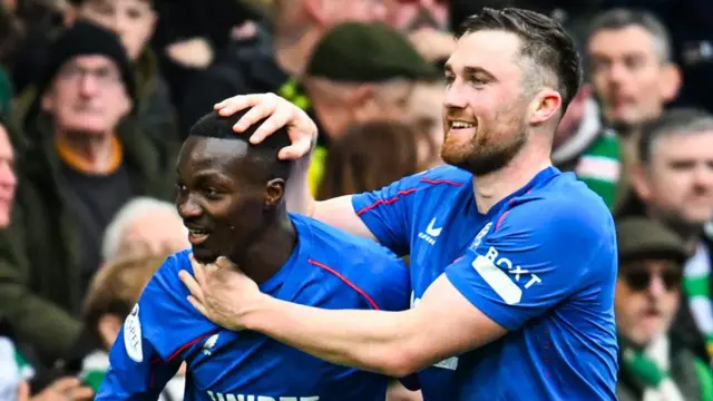 Rangers' Mohamed Diomande (L) celebrates scoring to make it 2-0 with teammate John Souttar during a Premiership match between Celtic and Rangers at Celtic Park