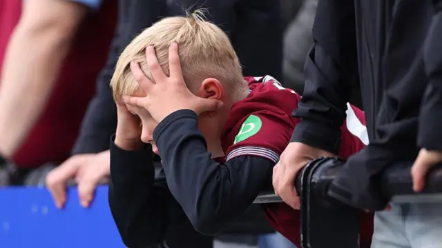 A West Ham United fan reacts