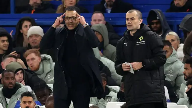 Liam Rosenior reacts during the match between Chelsea and Arsenal.