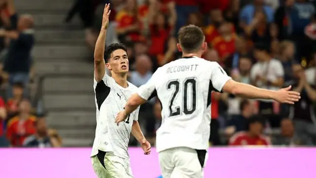 New Zealand's Elijah Just celebrates scoring against Belgium