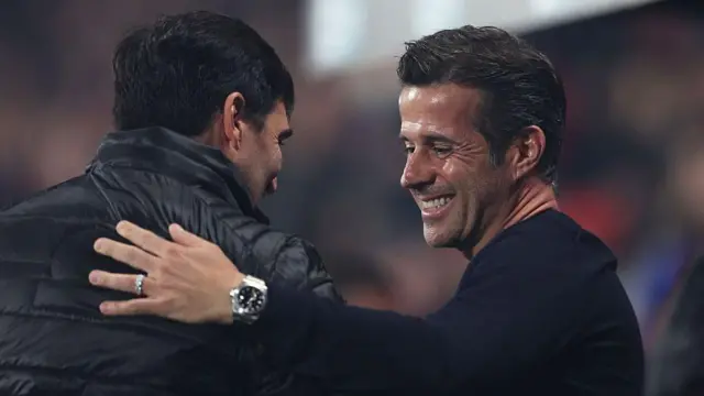 Marco Silva smiling as he greets Andoni Iraola