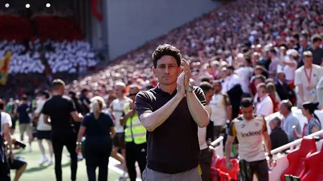Keith Andrews applauds fans