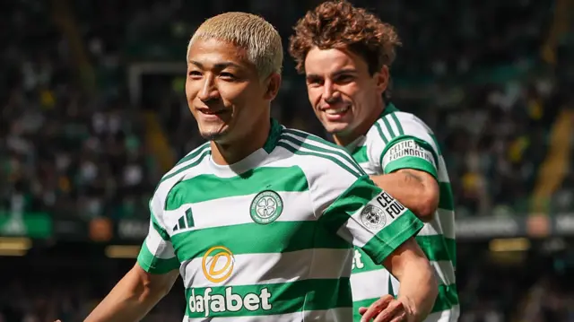 Celtic's Daizen Maeda celebrates with Reo Hatate after scoring to make it 1-0 during a Premier Sports Cup last sixteen match between Celtic and Hibernian at Celtic Park