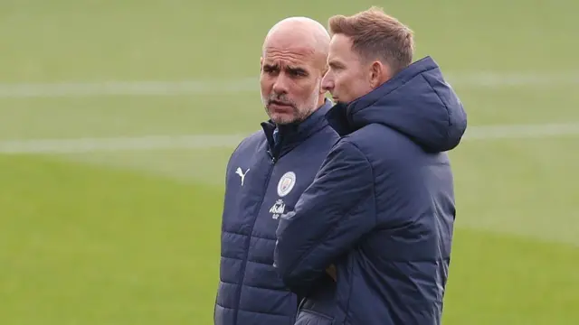 Manchester City manager Pep Guardiola speaks to his assistant Pep Lijnders