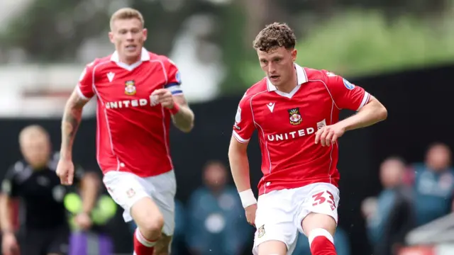 James McClean and Nathan Broadhead of Wrexham