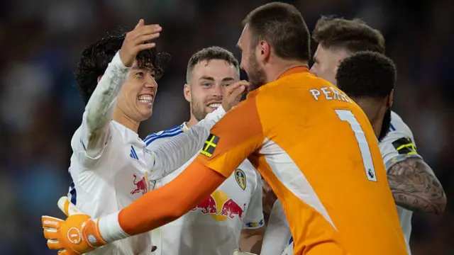 Leeds United players embrace in celebration